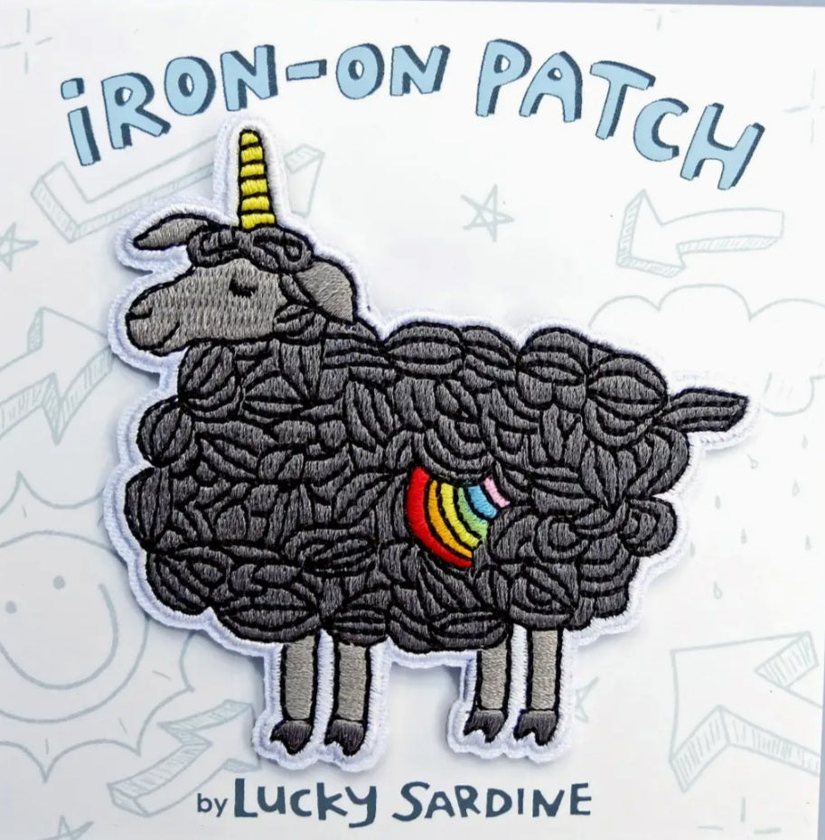 Iron-on patch: dark gray sheep with rainbow tail and yellow horn