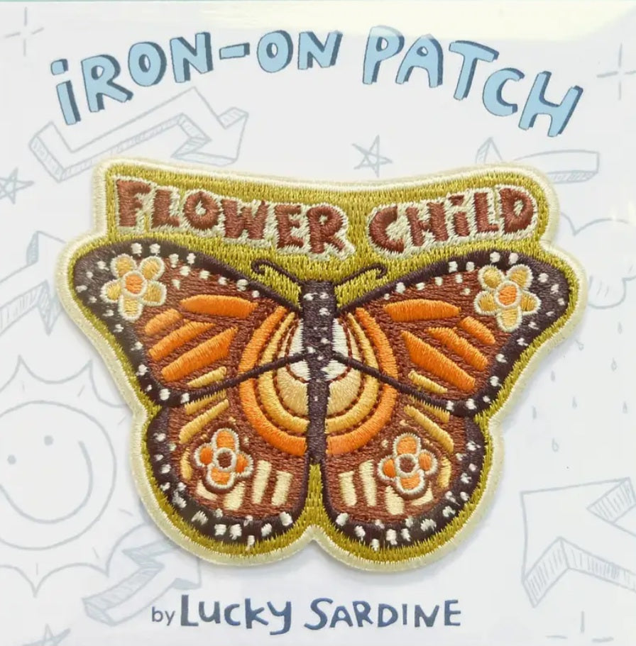 Butterfly iron-on patch: 'Flower Child' text and orange wings, by Lucky Sardine