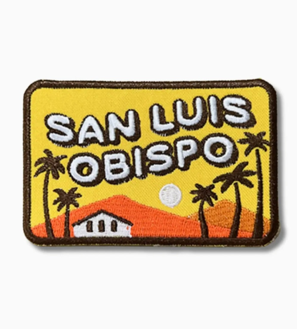 Retro iron-on patch with yellow background, SAN LUIS OBISPO text and orange landscape