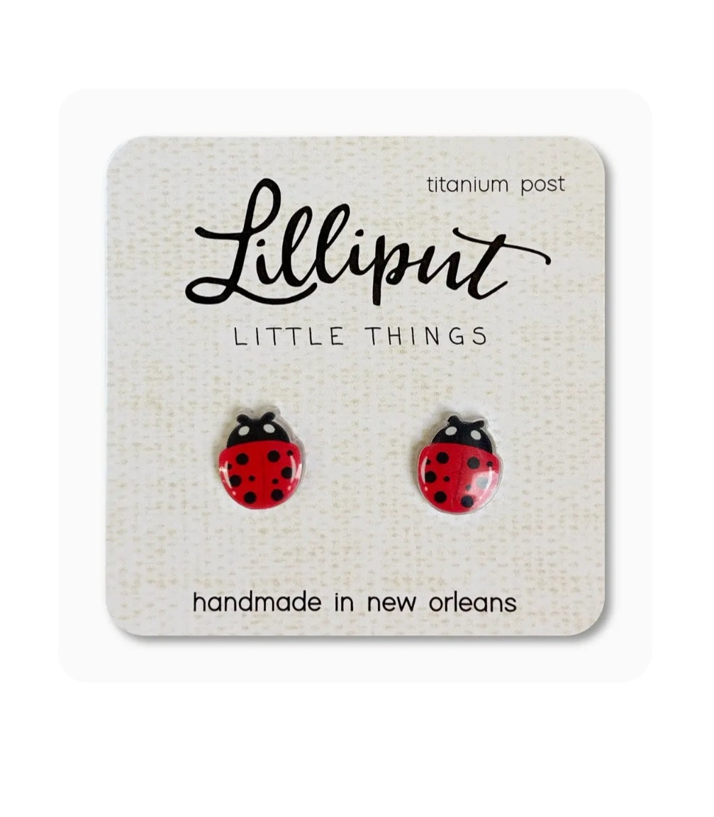 Ladybug stud earrings with red and black spotted ladybug motifs, titanium posts