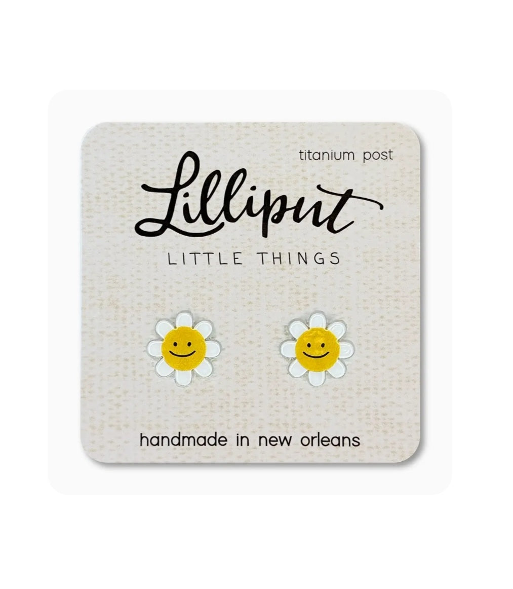 Lilliput smiling daisy earrings with white petals, yellow faces, and titanium posts