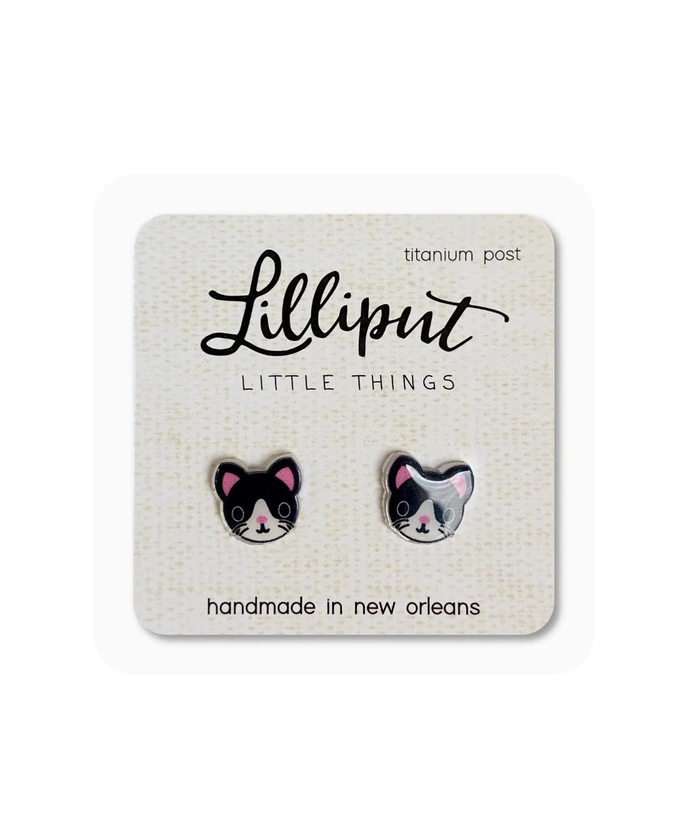 Black and white cat stud earrings with titanium posts, small enamel faces.