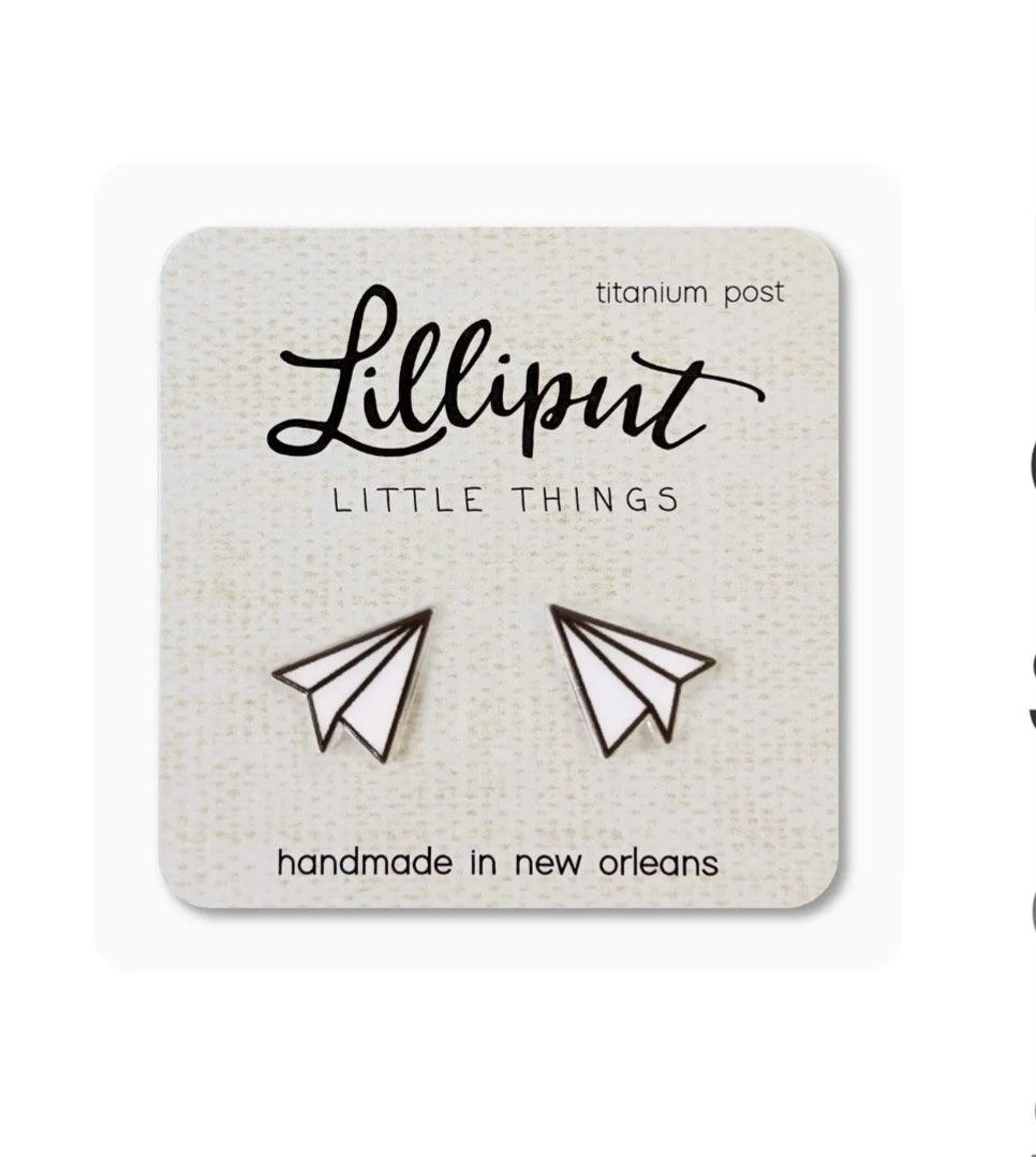 Small paper airplane stud earrings with dark outlines, titanium post