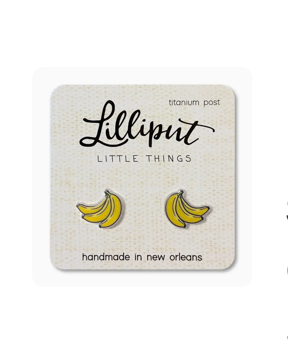 Lilliput banana stud earrings, yellow curved fruit with dark outlines, titanium posts
