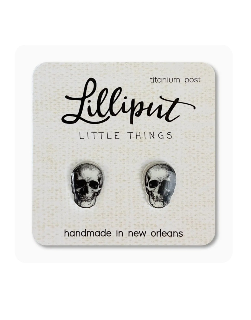 Skull stud earrings with silver-tone skulls and titanium posts, Lilliput