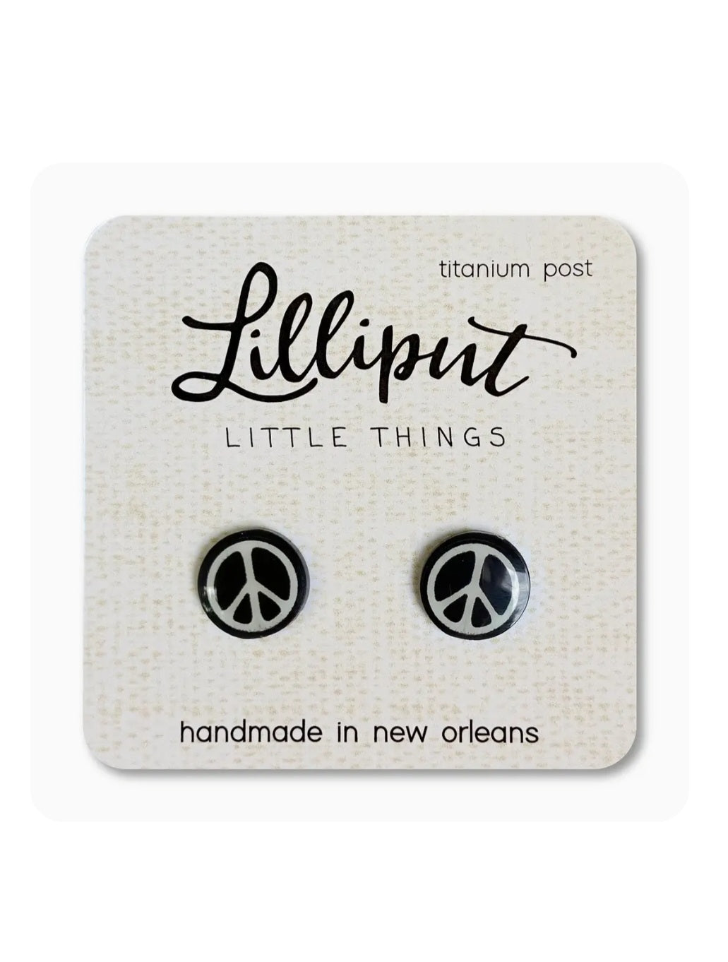 Peace sign stud earrings with black circular peace symbols, titanium post