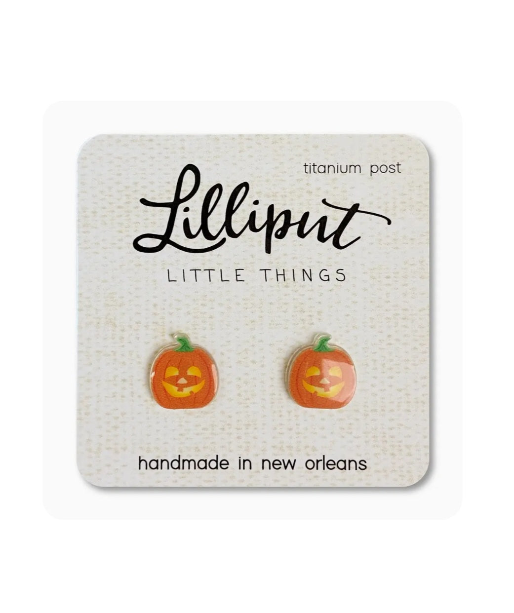 Jack-o-lantern stud earrings: orange pumpkin faces, green tops, titanium posts