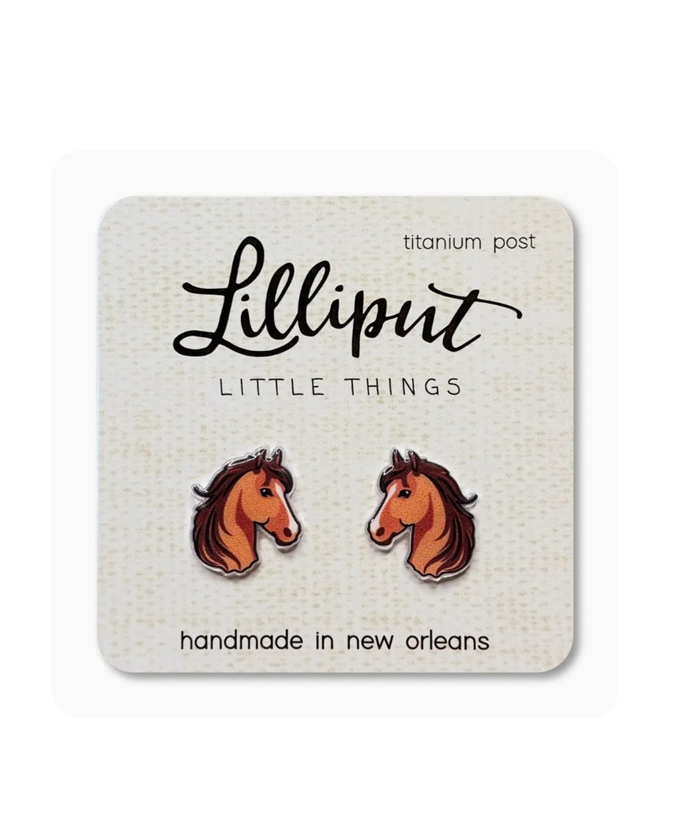 Horse head stud earrings with orange and brown details on titanium posts