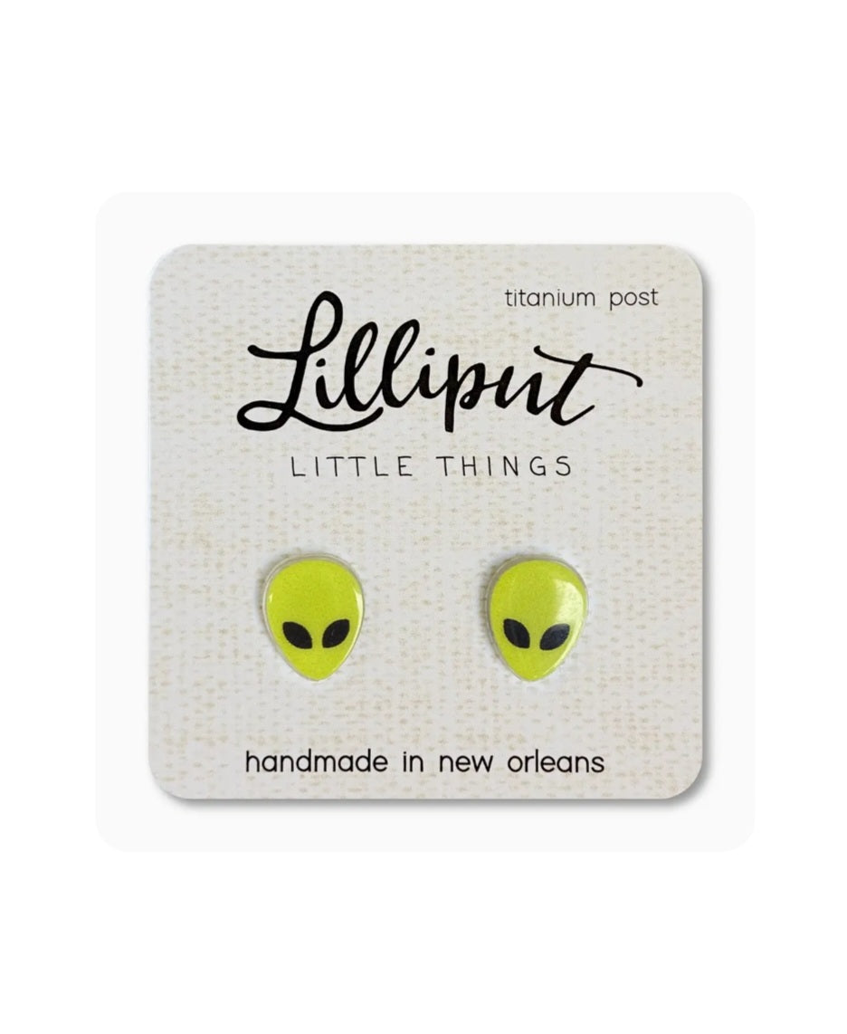 Alien face stud earrings, lime green with black details, on titanium posts.