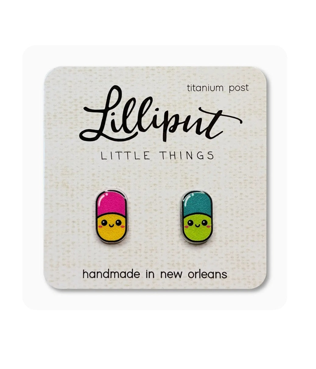 Pill-shaped stud earrings with colorful faces and titanium posts