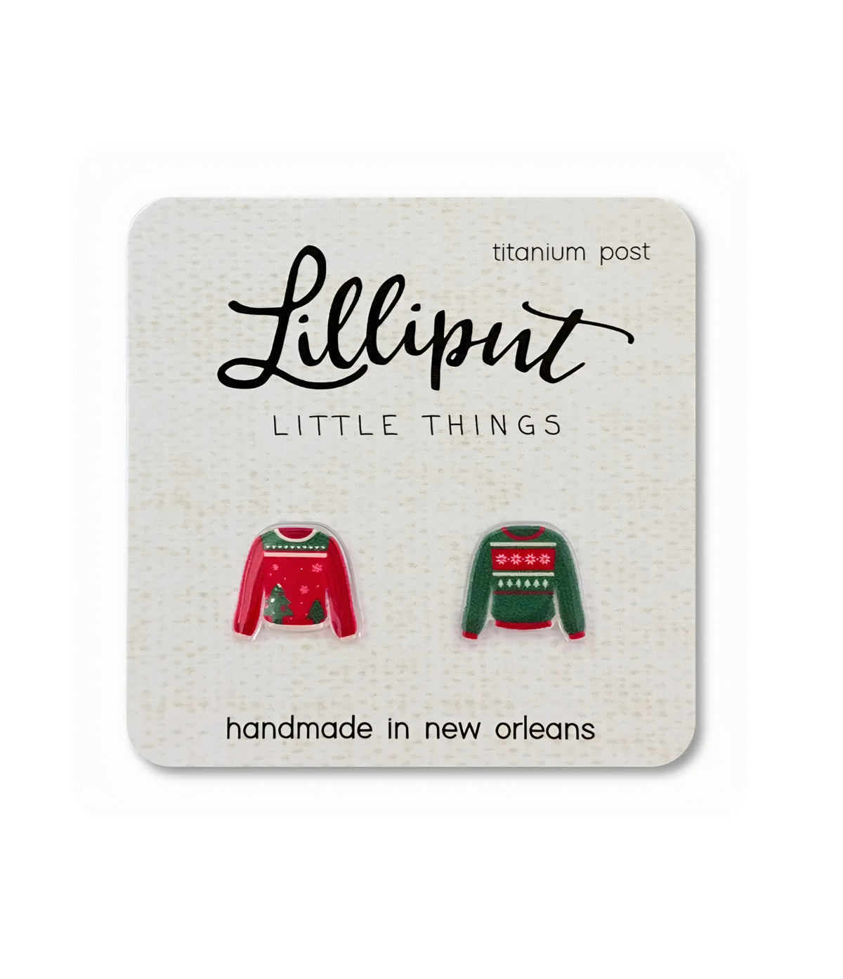 Enamel Christmas sweater earrings on titanium posts, red and green with knit patterns.