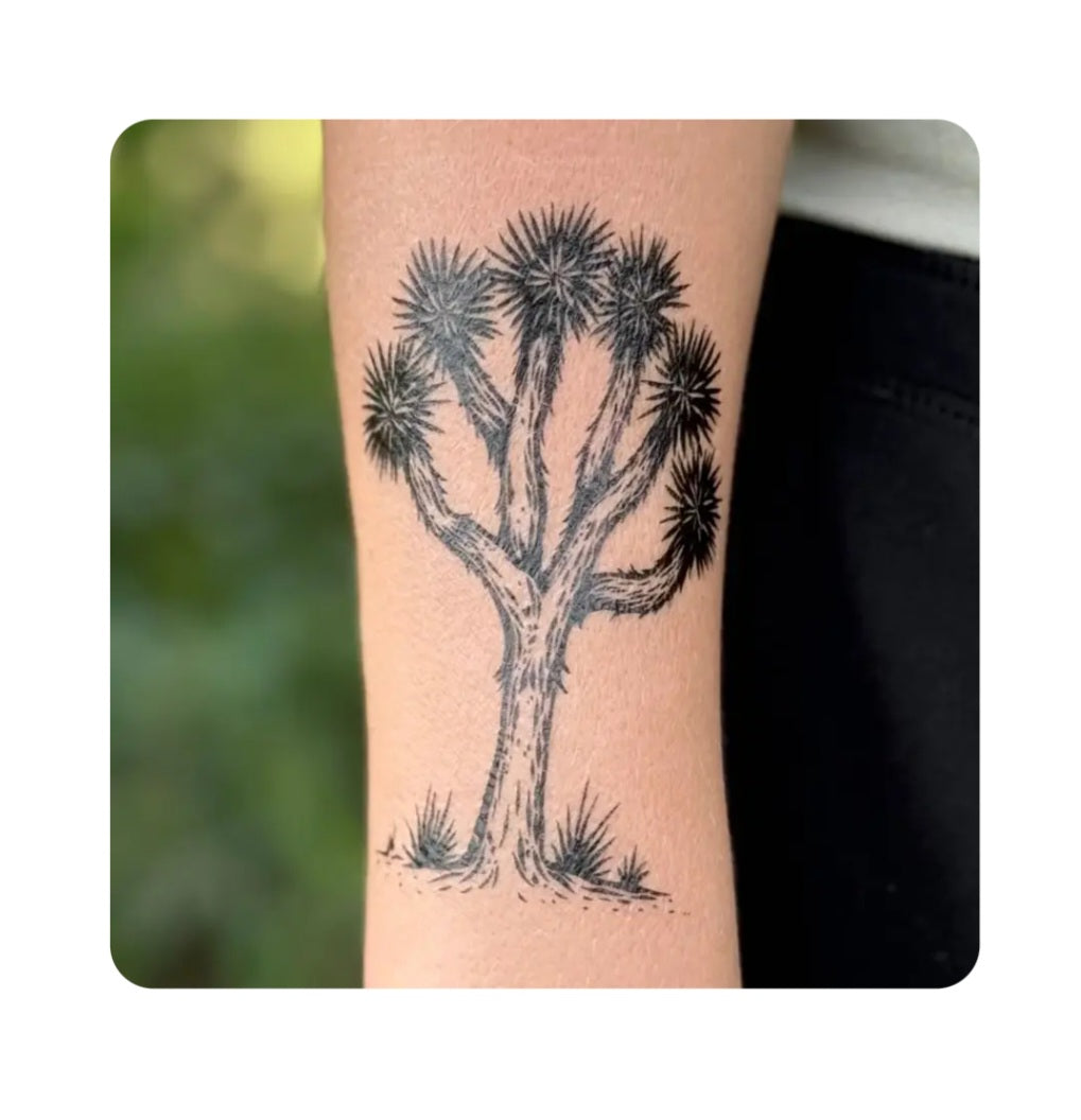 Joshua Tree temporary tattoo design on bare arm, black ink style