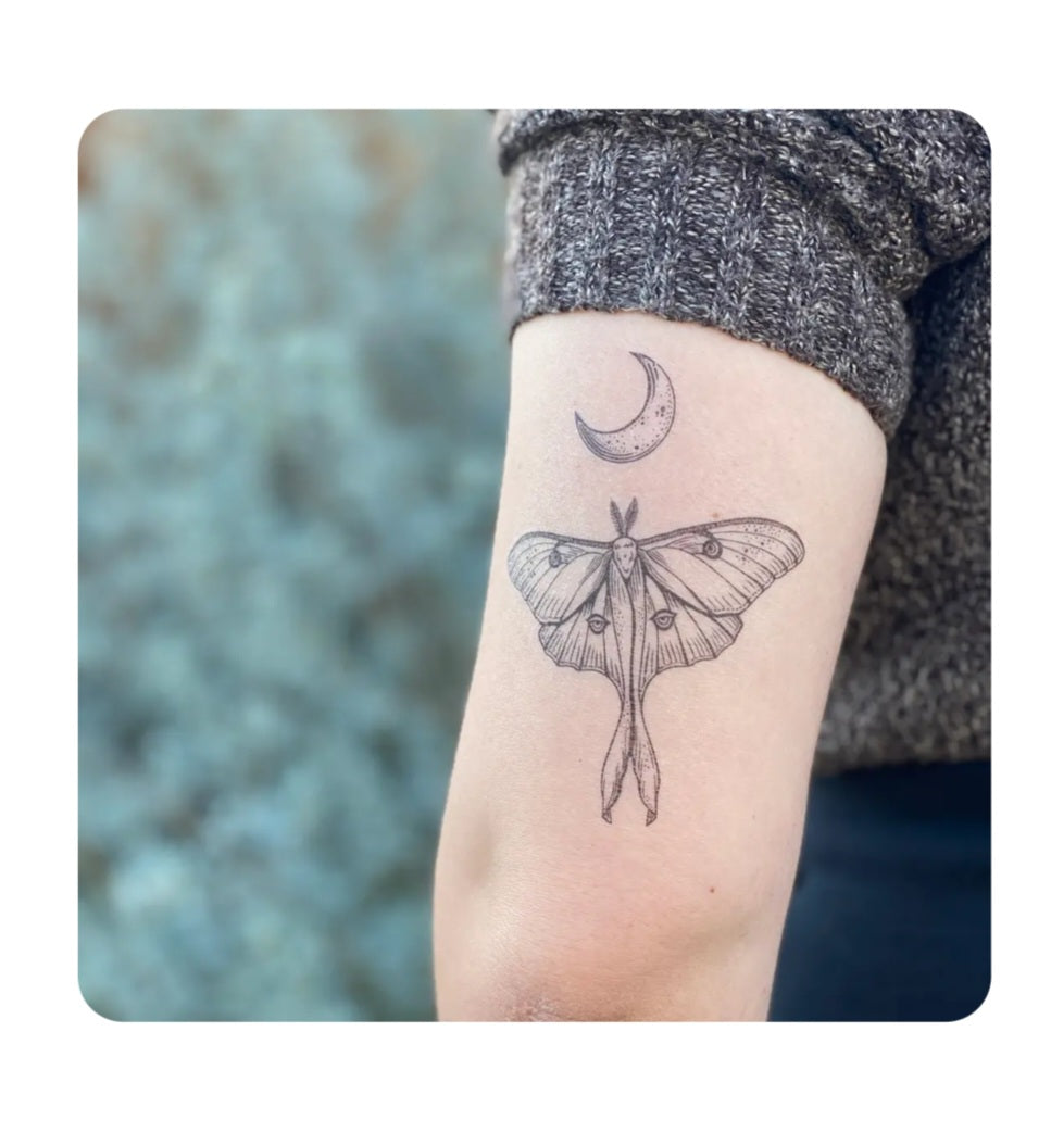 Moth temporary tattoo on wrist with detailed line art moth and crescent moon