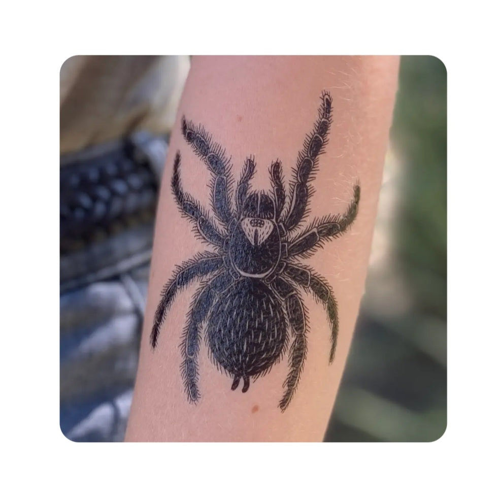 Tarantula temporary tattoo on skin, black spider design with detailed legs
