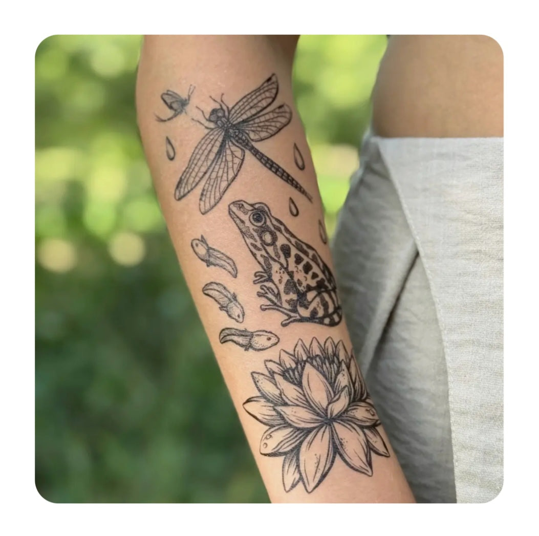 Temporary tattoo with dragonfly, patterned animal, flower and raindrop motifs on skin