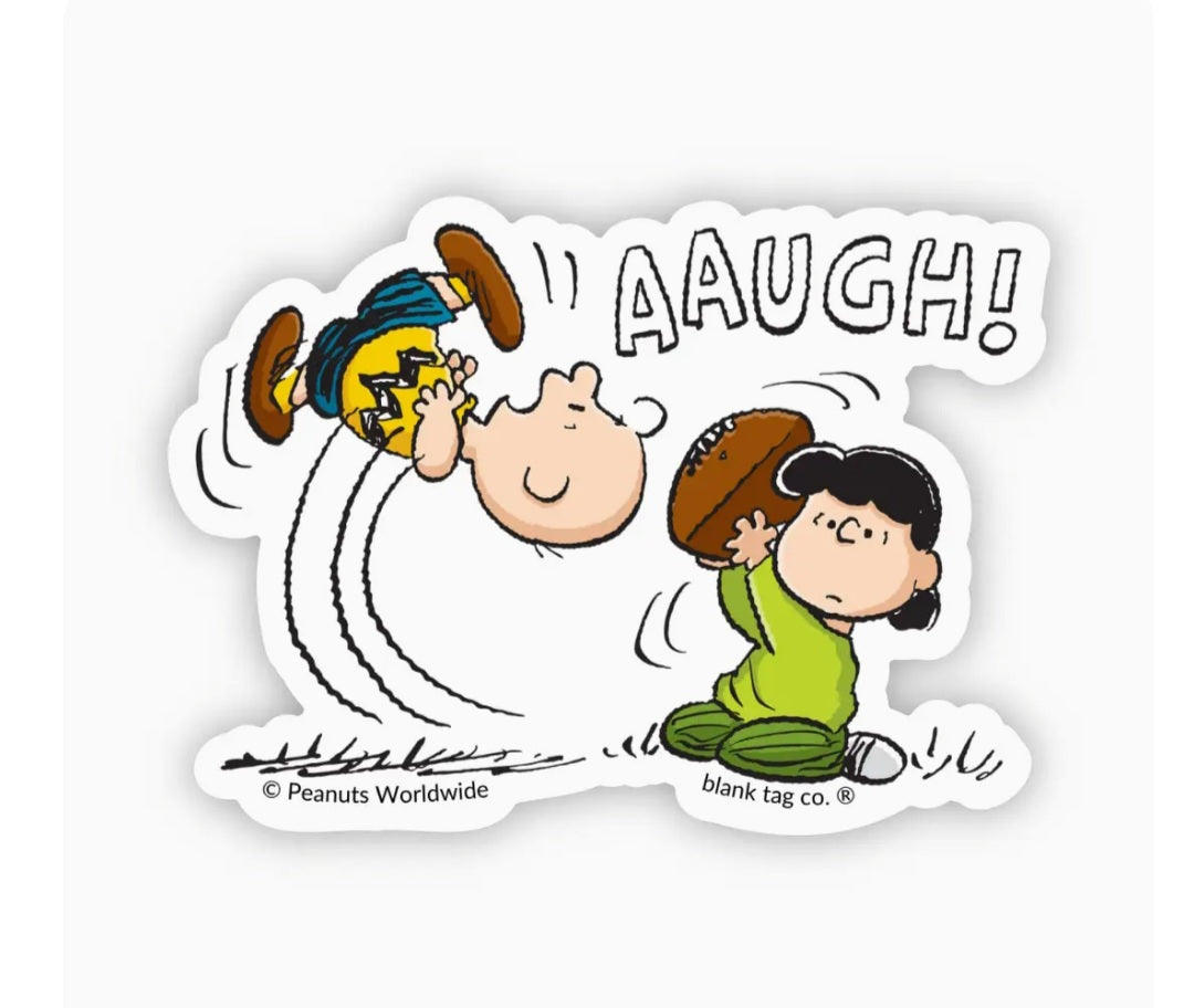 Peanuts waterproof sticker with Lucy pushing a football, speech bubble “AAUGH!”