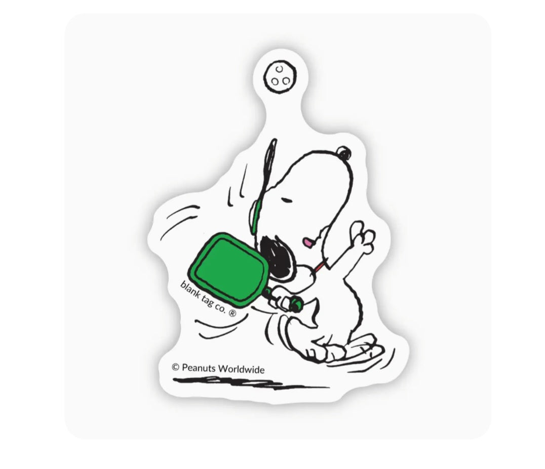 Waterproof Peanuts sticker of Snoopy holding green pickleball paddle