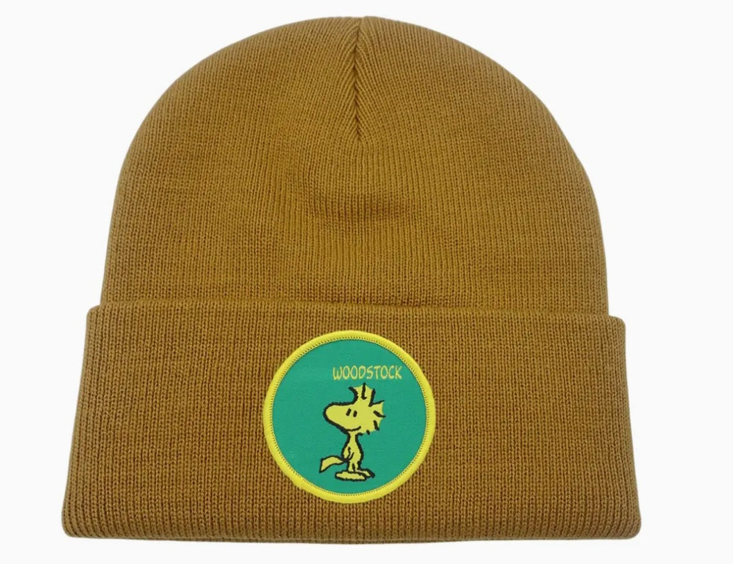 Tan knit beanie with green circular Peanuts patch