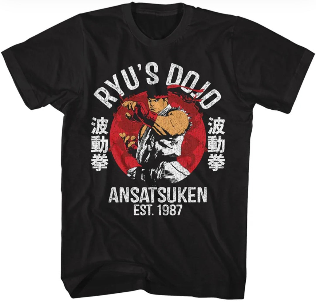 Black graphic t-shirt with illustrated fighter and ANSATSU KEN, EST. 1987 text